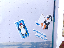 Load image into Gallery viewer, Mini stickers of cute penguins and text. Stickers sheet handmade in the UK.